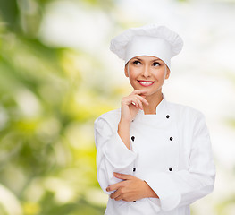 Image showing smiling female chef dreaming