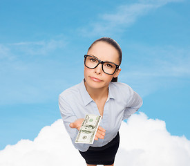 Image showing smiling businesswoman with dollar cash money