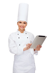 Image showing smiling female chef with tablet pc computer