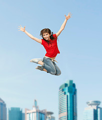 Image showing smiling girl jumping