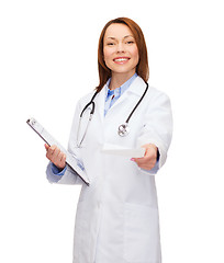 Image showing smiling female doctor with clipboard