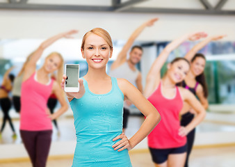 Image showing sporty woman with smartphone