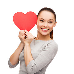 Image showing smiling asian woman with red heart