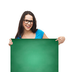 Image showing smiling girl with eyeglasses and white blank board