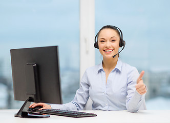 Image showing female helpline operator showing thumbs up