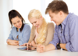 Image showing smiling students with tablet pc computer at school