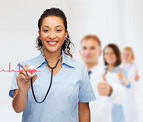 Image showing smiling female african american doctor or nurse