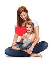 Image showing happy mother with adorable little girl and heart