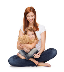 Image showing happy mother with adorable girl and teddy bear