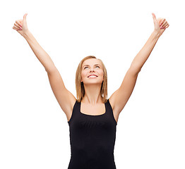 Image showing woman in blank black tank top showing thumbs up