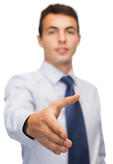 Image showing buisnessman with open hand ready for handshake