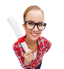 Image showing smiling woman in black eyeglasses with diploma