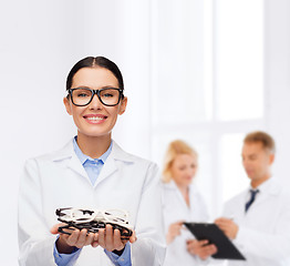 Image showing smiling female doctor with eyeglasses