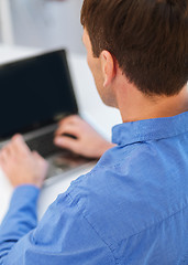 Image showing close up of man with laptop computer