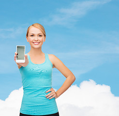 Image showing sporty woman with smartphone