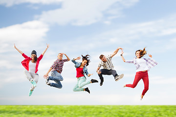 Image showing group of teenagers jumping