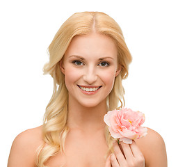 Image showing smiling woman with peony flower