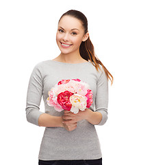 Image showing young woman with bouquet of flowers