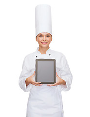 Image showing smiling female chef with tablet pc blank screen