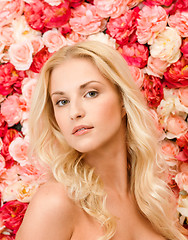 Image showing beautiful woman and background full of roses