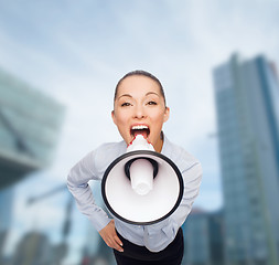 Image showing screaming businesswoman with megaphone