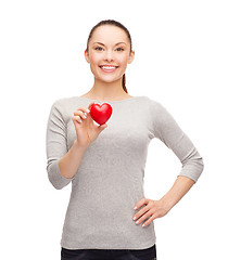 Image showing smiling asian woman with red heart