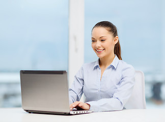 Image showing businesswoman with laptop in office