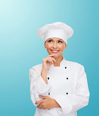 Image showing smiling female chef dreaming