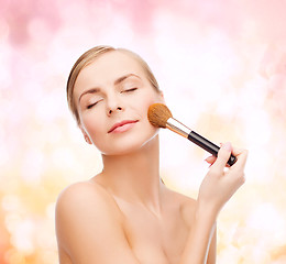 Image showing beautiful woman with makeup brush