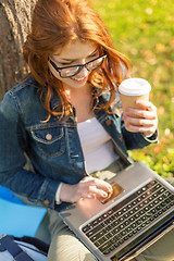 Image showing teenager in eyeglasses with laptop and coffee