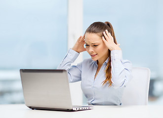 Image showing stressed woman with laptop