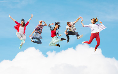 Image showing group of teenagers jumping