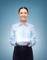 Image showing smiling businesswoman with blank tablet screen