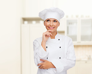 Image showing smiling female chef dreaming