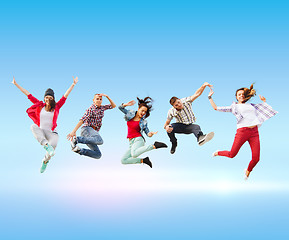 Image showing group of teenagers jumping