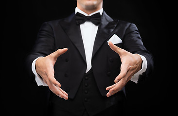 Image showing magician in top hat showing trick