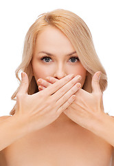 Image showing beautiful woman covering her mouth