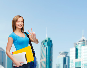 Image showing female student with bag, tablet pc and folders