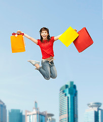 Image showing excited girl with shopping bags