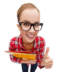 Image showing student in glasses with folders showing thumbs up