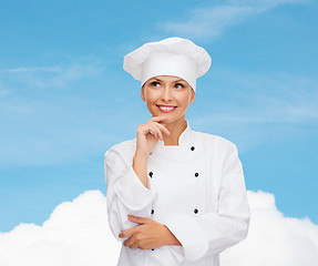 Image showing smiling female chef dreaming