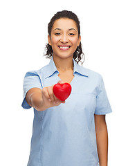 Image showing smiling female doctor or nurse with heart