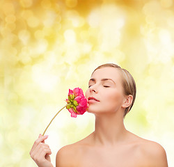 Image showing lovely woman with peonie flower