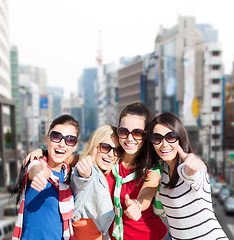 Image showing teenage girls or young women showing thumbs up