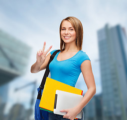 Image showing female student with bag, tablet pc and folders