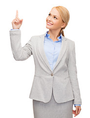 Image showing smiling businesswoman with her finger up