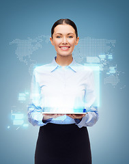 Image showing businesswoman with tablet pc and world hologram