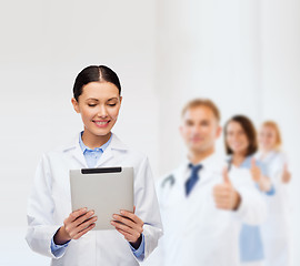 Image showing female doctor without stethoscope and tablet pc