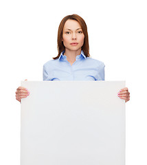 Image showing young calm businesswoman with white blank board