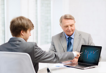 Image showing older man and young man with laptop computer